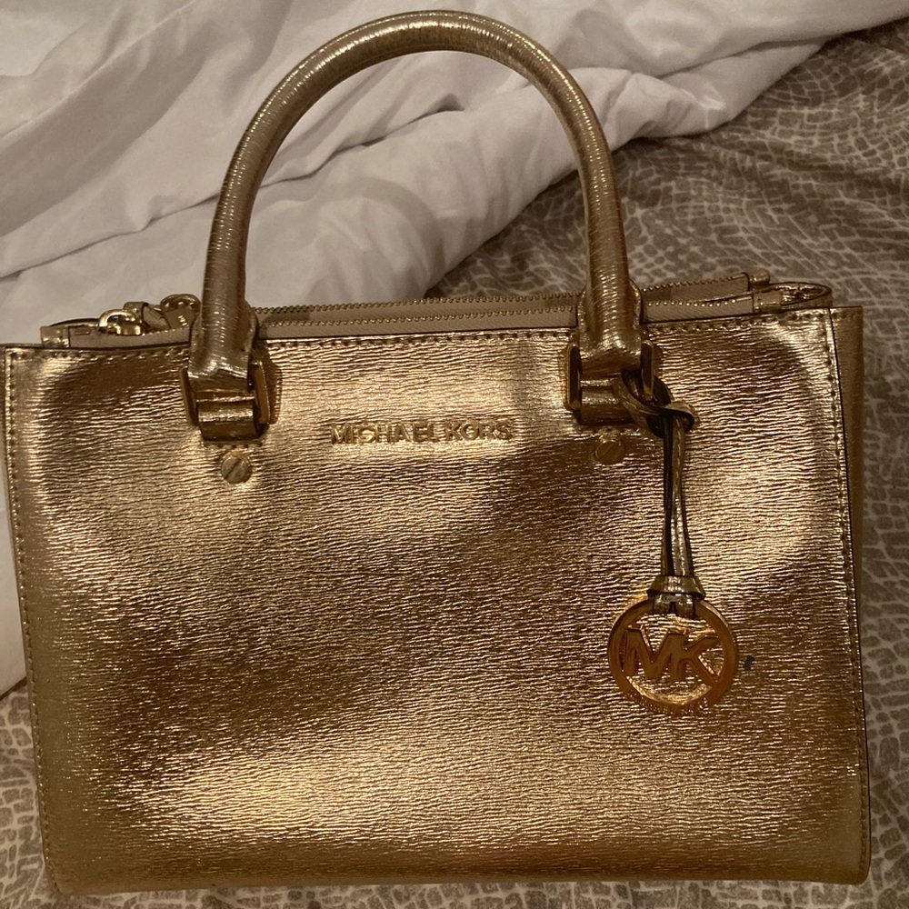 Beautiful Michael Kors gold handbag . Medium size